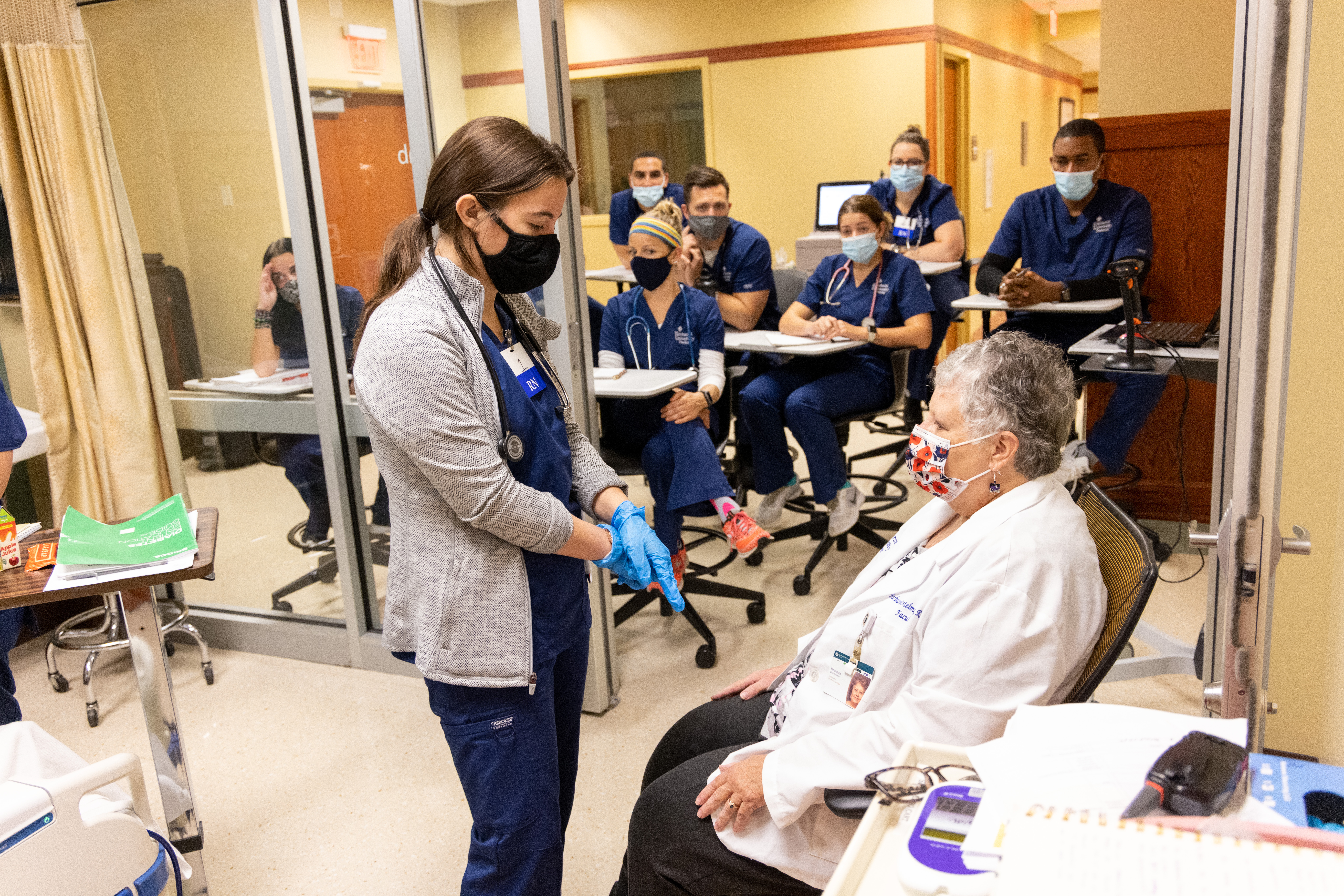 An Elmhurst student training with her instructor during the on-campus Elmhurst nursing residency