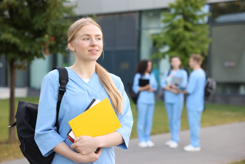 A pre-med student walking across campus
