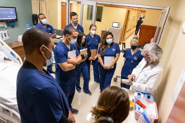 ABSN students during the Elmhurst on-campus practicum learning from one of our tenured nursing professors