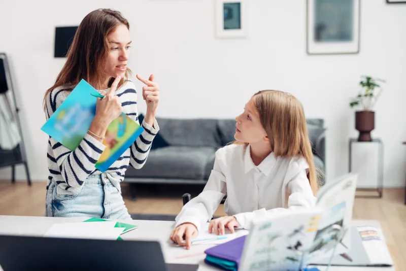 A Speech-Language pathologist working with a young client in a private practice setting