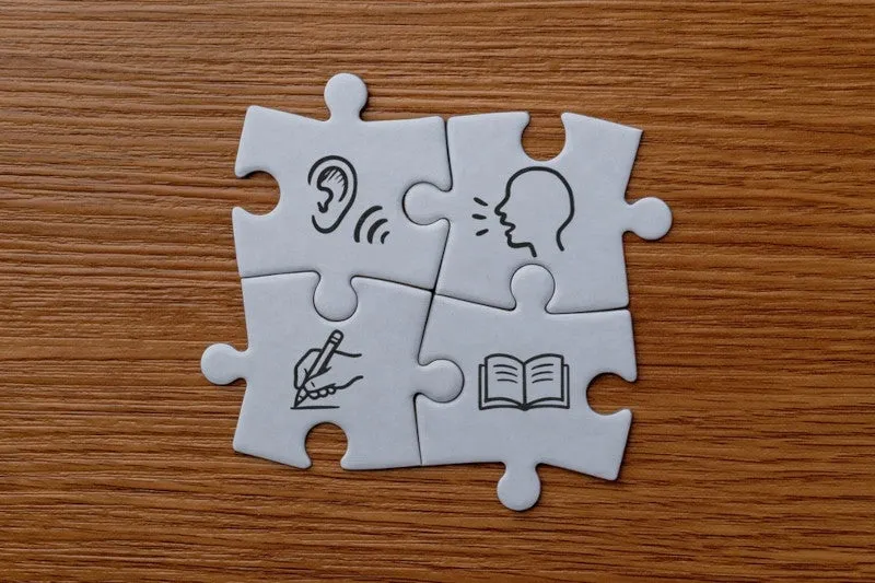 A jigsaw puzzle with different icons representing different communication disorders 