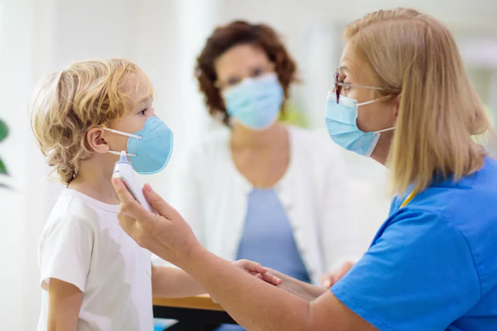 A nurse providing holistic care to her young patient