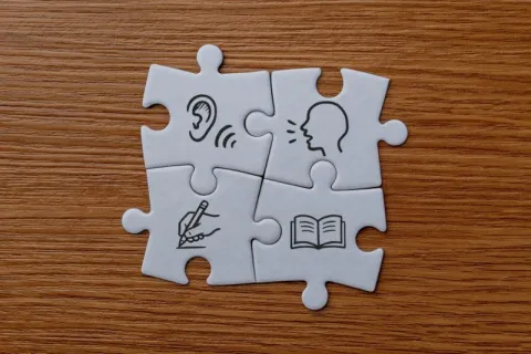 A jigsaw puzzle with different icons representing different communication disorders 